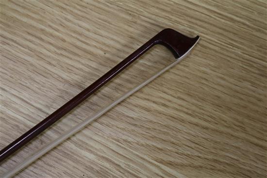 A silver mounted violin bow, an ivory mounted violin bow and a late 19th century German violin, cased